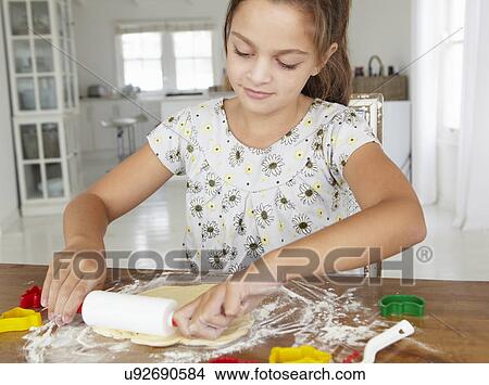 Young girl baking View Large Photo Image Picture - Young girl baking. Fotosearch