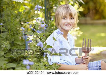 Young girl gardening View Large Photo Image Picture - Young girl gardening. Fotosearch