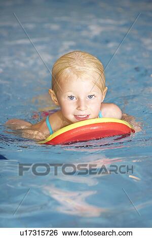 Young girl in swimming pool View Large Photo Image Stock Photograph - Young girl in swimming pool. Fotosearch
