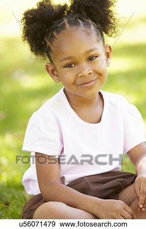 Young girl portrait outdoors View Large Photo Image Stock Photo - Young girl portrait outdoors. Fotosearch