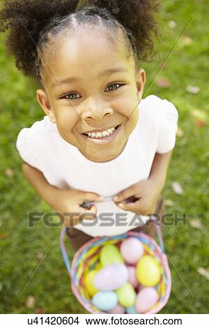 Young girl with Easter eggs View Large Photo Image Picture - Young girl with Easter eggs. Fotosearch