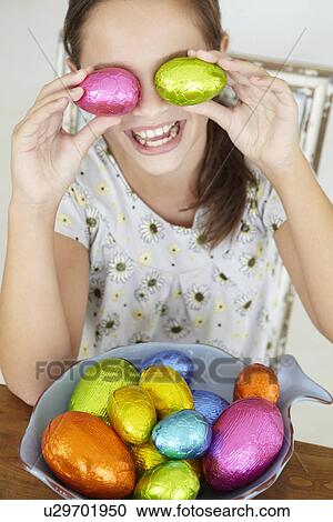 Young girl with Easter eggs View Large Photo Image Stock Image - Young girl with Easter eggs. Fotosearch