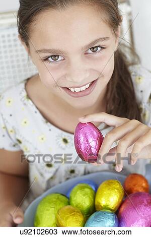Young girl with Easter eggs View Large Photo Image Stock Image - Young girl with Easter eggs. Fotosearch