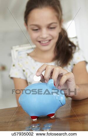 Young girl with piggy bank View Large Photo Image Stock Image - Young girl with piggy bank. Fotosearch