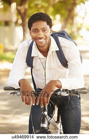 Young Man Cycling Along Street To Work View Large Photo Image Picture - Young Man Cycling Along Street To Work. Fotosearch