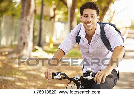 Young Man Cycling Along Street To Work View Large Photo Image Stock Image - Young Man Cycling Along Street To Work. Fotosearch