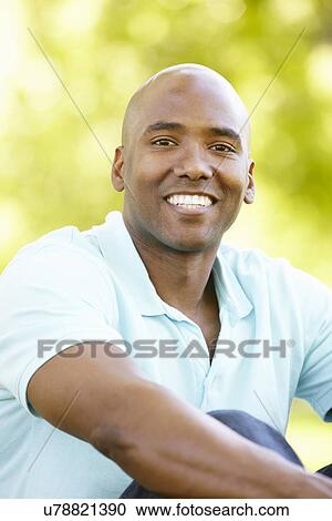 Young man portrait outdoors View Large Photo Image Stock Image - Young man portrait outdoors. Fotosearch