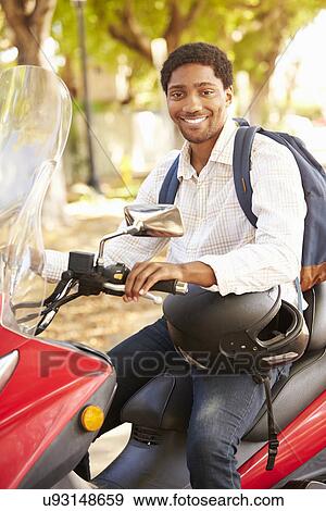 Young Man Riding Motor Scooter To Work View Large Photo Image Stock Photo - Young Man Riding Motor Scooter To Work. Fotosearch