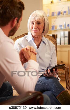 Young Man Talking To Counsellor Using Digital Tablet View Large Photo Image Stock Image - Young Man Talking To Counsellor Using Digital Tablet. Fotosearch