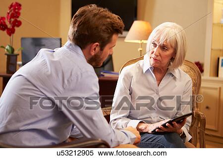 Young Man Talking To Counsellor Using Digital Tablet View Large Photo Image Stock Photography - Young Man Talking To Counsellor Using Digital Tablet. Fotosearch