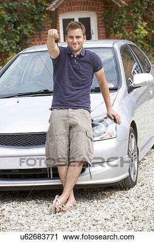 Young man with car View Large Photo Image Stock Image - Young man with car. Fotosearch