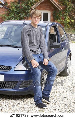 Young man with car View Large Photo Image Stock Image - Young man with car. Fotosearch