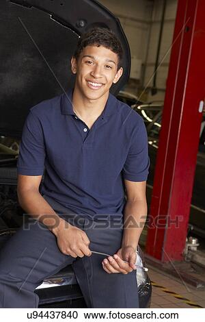 Stock Image - Young mechanic at work. Fotosearch