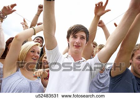 Young people at music festival View Large Photo Image Stock Image - Young people at music festival. Fotosearch