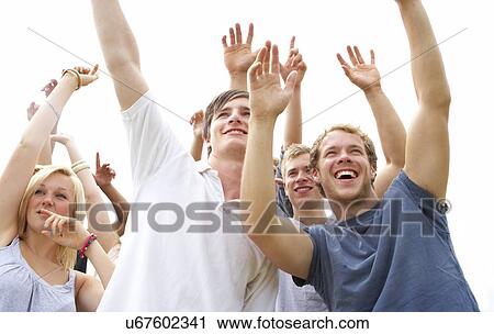 Young people at music festival View Large Photo Image Stock Image - Young people at music festival. Fotosearch