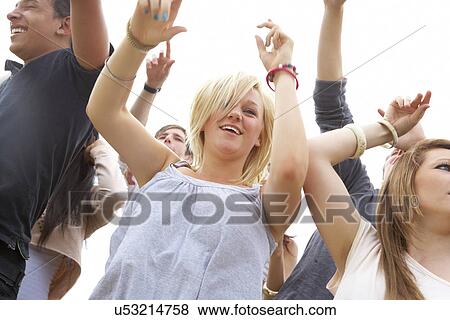 Young people at music festival View Large Photo Image Stock Photo - Young people at music festival. Fotosearch