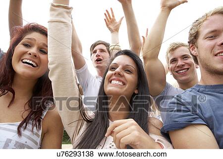 Young people at music festival View Large Photo Image Stock Photo - Young people at music festival. Fotosearch