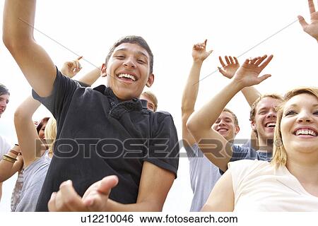 Young people at music festival View Large Photo Image Stock Photograph - Young people at music festival. Fotosearch