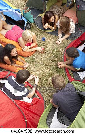 Stock Image - Young people on camping trip. Fotosearch