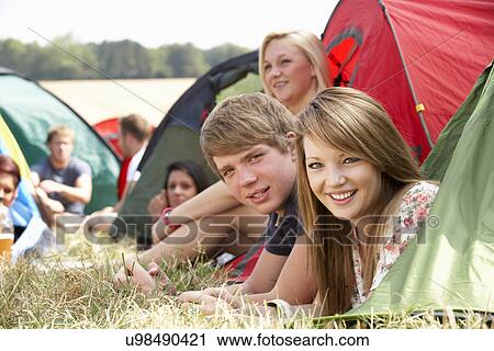 Stock Image - Young people on camping trip. Fotosearch
