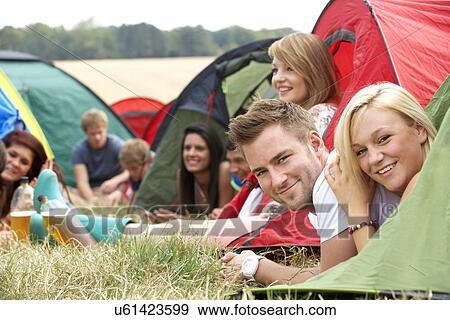 Stock Photo - Young people on camping trip. Fotosearch