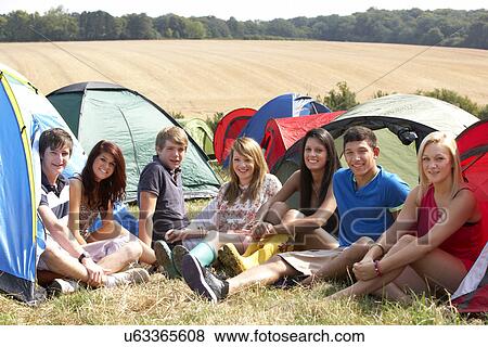 Stock Photo - Young people on camping trip. Fotosearch