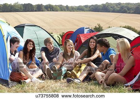 Stock Photo - Young people on camping trip. Fotosearch