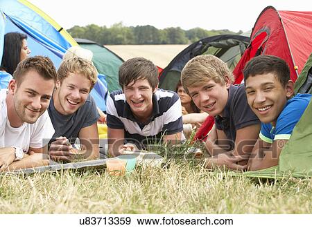 Stock Photo - Young people on camping trip. Fotosearch