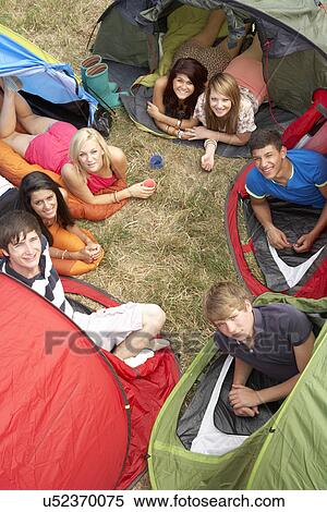 Stock Photography - Young people on camping trip. Fotosearch