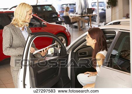 Young woman buying new car View Large Photo Image Stock Image - Young woman buying new car. Fotosearch