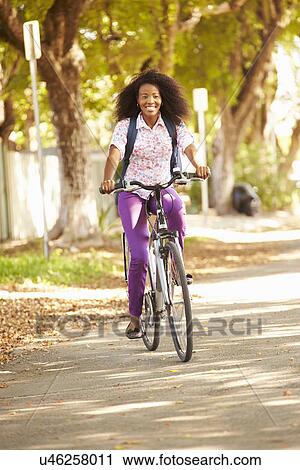 Young Woman Cycling Along Street To Work View Large Photo Image Stock Image - Young Woman Cycling Along Street To Work. Fotosearch