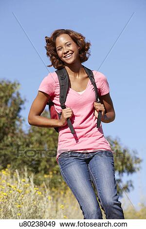Young woman on country hike View Large Photo Image Stock Photo - Young woman on country hike. Fotosearch