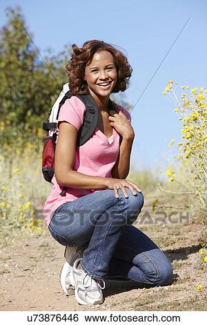 Young woman on country hike View Large Photo Image Stock Photograph - Young woman on country hike. Fotosearch