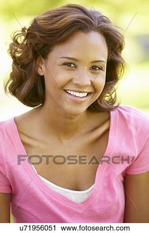 Young woman portrait outdoors View Large Photo Image Stock Image - Young woman portrait outdoors. Fotosearch
