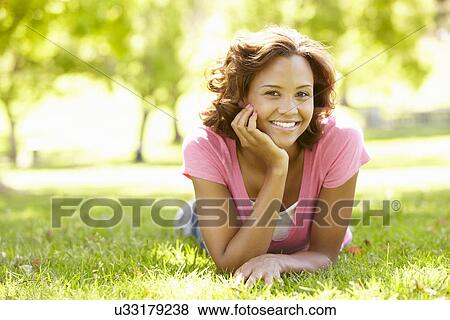 Young woman portrait outdoors View Large Photo Image Stock Photo - Young woman portrait outdoors. Fotosearch