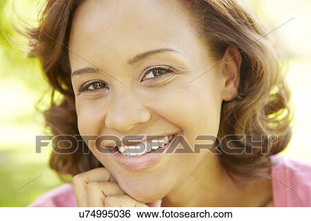 Young woman portrait outdoors View Large Photo Image Stock Photograph - Young woman portrait outdoors. Fotosearch