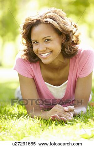 Stock Photography - Young woman portrait outdoors. Fotosearch