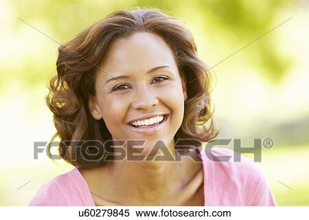 Young woman portrait outdoors View Large Photo Image Stock Photography - Young woman portrait outdoors. Fotosearch