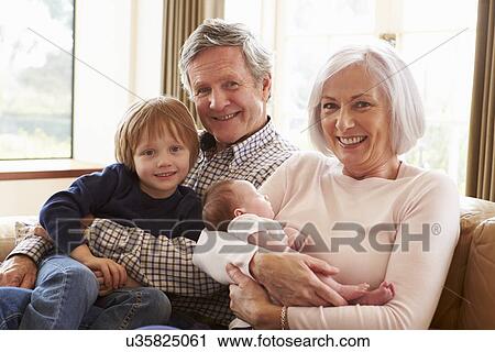 Young Woman Using Digital Tablet At Home View Large Photo Image Stock Image - Young Woman Using Digital Tablet At Home. Fotosearch