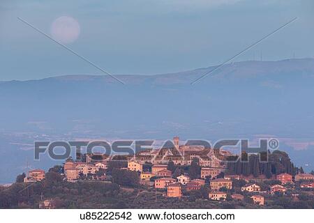 Stock Image - Full moon over MonteCastello di Vibio, Umbria Italy. Fotosearch