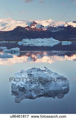 Iceberg at sunrise View Large Photo Image Stock Photo - Iceberg at sunrise. Fotosearch