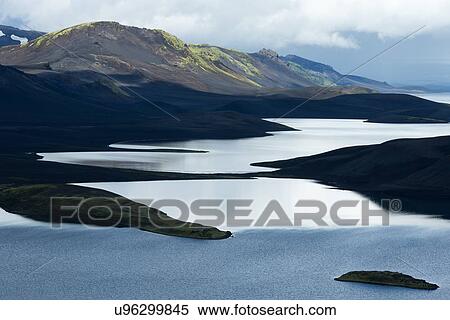 Stock Photography - Iceland summer: lake and clouds. Fotosearch