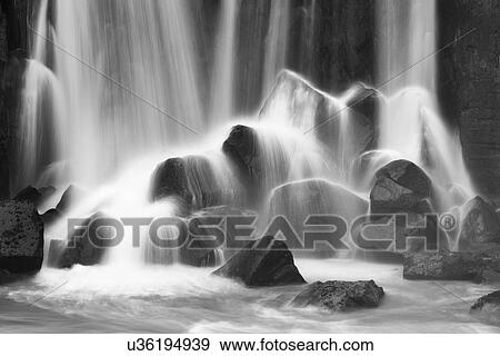Stock Photo - Water and rocks. Fotosearch