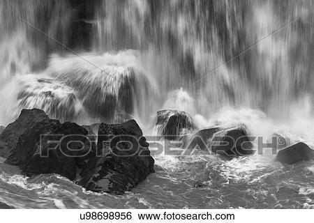 Stock Photograph - Water and rocks. Fotosearch
