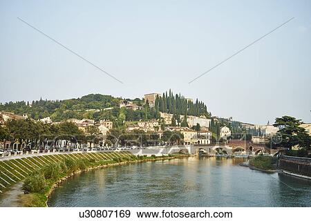 Stock Photo - Adige River and cityscape, Verona, Italy. Fotosearch