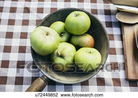 Stock Image - Apples in a pan. Fotosearch