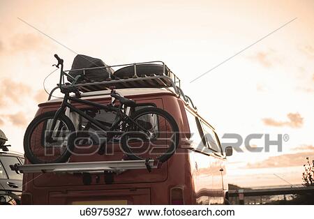 Stock Photo - Bicycle on back of recreational vehicle. Fotosearch