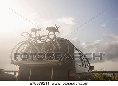 Stock Image - Bicycles on bike rack on van. Fotosearch