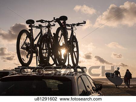 Bicycles on top of car roof View Large Photo Image Stock Image - Bicycles on top of car roof. Fotosearch