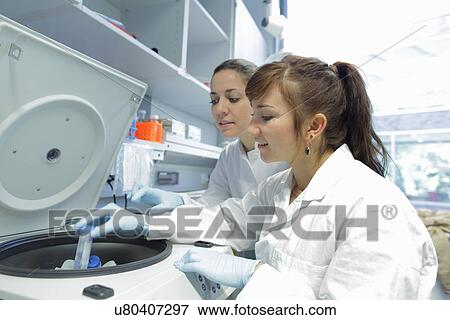 Stock Photo - Biology lab technicians at work. Fotosearch